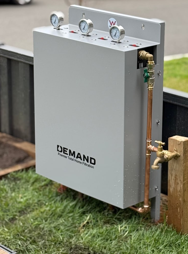 Demand Filtration plumber installing a whole-home filtration unit